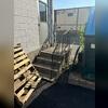 The previous precast stair assembly had undergone considerable settlement, creating a non-compliant transition between the entrance doorway and stair landing. To restore safe access and ensure code compliance, the stairs required immediate replacement and elevation correction.