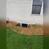 These window wells were old pieces of wood. The wood was shifting and the homeowner was concerned. They also weren't covered which allowed for a lot of water to pool by the basement windows.