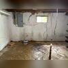 Before, this basement had large cracks in the walls, as well as water on the ground. The water is a sign of water seepage, and the cracks are a sign of foundation settling.