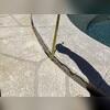 This photo documents significant settlement along the pool deck where the concrete had separated, creating a large elevation difference and trip hazard before repairs began.