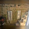 This photo highlights the 2 GeoLock Wall Anchors that were installed to support this failing retaining wall.