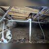 The damp crawl space before being encapsulated by our team.