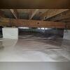 This photo shows our CleanSpace Vapor Barrier installed in this crawl space. The CleanSpace Barrier keeps moisture and humidity out of the space.