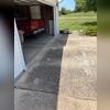 After the repair, the driveway is now level. Those small white patches are where the PolyLevel was injected to lift the slabs back into position.