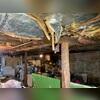 The existing wooden support posts were no longer capable of adequately carrying the structural loads from the floor system above, resulting in noticeable floor deflection and sagging throughout the living space.