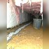 Digging a trench around the perimeter and installing our waterproofing pipe, covering everything with clean crushed stone and tying everything together at the sump pump