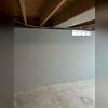 The large crack stretching across the wall is usually a sign of the basement walls moving inward.
