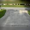 The driveway is cracked and unlevel.