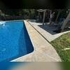The sunken concrete not only caused safety issues but also detracted from the pool's appearance.