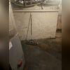 The damp basement before the waterproofing project.