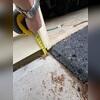 Team Woods will have to lift this slab about three inches. The sidewalk should sit level with the driveway.
