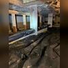 Fiberglass insulation was falling from the subfloor, pieces laying on the old vapor barrier along with dirt.
