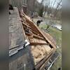 After the removal of the existing damaged shingle and wood decking.