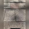 Multiple areas of the roof look just like this. Separating and cracked roofing shingles. Once this layer of roofing is compermised, this will cause decking issues and possibly water penetration. Several areas of the roof show separating and cracked shingles. Once this layer of roofing is compromised, it may lead to decking issues and possible water penetration into the attic.