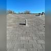 Close-up of a properly sealed roof vent and pipe boot after a wind-damage repair in Cibolo, TX.