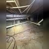 During inspection, this crawl space has lots of dust and debris over the old crawl space barrier. Mold growth was also present on the wood floor joists.