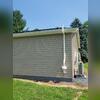 Exterior Radon System at the back of the three car garage