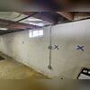 The foundation wall exhibited both horizontal and stair-step cracking-clear indicators of lateral soil pressure compromising the wall's structural stability. While the painted wall surface concealed many of these warning signs, our comprehensive inspection identified the underlying damage and...