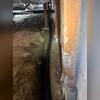 A trench was dug along the crawl space perimeter to make room for the installation of a Perf Pipe drainage system.