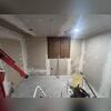 The homeowner was in the process of finishing the basement, but first needed an Egress Window Well installed to comply with town safety codes.