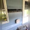 The siding is removed, and access areas are made in preparation for the RetroFoam Injection. These holes are created to allow for an easy access area for the material that is later injected into the wall cavity.