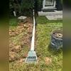 The crew extends the sump pump discharge line beneath the ground to drain water away from the foundation.