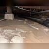 This crawl space shows aging support piers and uneven soil conditions prior to SmartJack&reg; installation. Our inspection identified areas requiring additional structural support to stabilize the home's floor system.