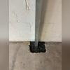 Installing engineered steel PowerBraces to reinforce and stabilize the foundation walls.