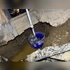 A utility bucket was being used in an attempt to temporarily pump water out of the home, but it just wasn't enough to keep up with the amount of water entering the crawl space. This home needed a permanent solution.