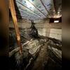 This before photo displays the torn vapor barrier, dirt, and unsafe crawl space.