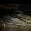 The damp crawl space before the encapsulation project.