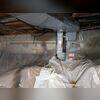 Standing moisture and debris highlight why encapsulation is needed for this space.