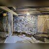 The absence of a proper footing, combined with decades of soil pressure and foundation movement, caused this fieldstone wall to settle and progressively shift inward. Visible signs of structural distress, including displaced stones, widening cracks, and wall deformation, indicated that the...