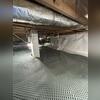 Drainage matting forms a permanent seal for leaking crawl space floors.
