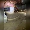 The space shows signs of mold, decay, and insufficient airflow before remediation.