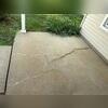 This porch was cracked and sinking in various areas.