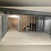 Our basement finishing crew installs panel insulation and metal framing to support the EverLast wall panels.