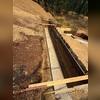 This photo shows this below-grade foundation wall before installation of our Paraseal and TremDrain, to protect the wall from water intrusion.