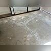 Several intersecting cracks were uncovered beneath the flooring of this Bonita home. The perpendicular markings show planned crack stitch locations used during the repair process to reinforce the cracked concrete slab.
