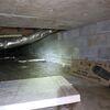 Efflorescence, a white, chalky residue, was evidence of moisture intrusion in the crawl space.