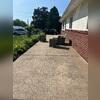 This patio had settled toward the home, creating an uneven surface and making proper drainage more difficult.