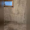 This small basement window was leaking whenever water pooled up outside of it. The homeowner also didn't like how small the window was.