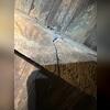 The beam that supports the floor above is old, cracked, and decaying.