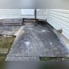 This section of concrete near a side entrance had settled and become uneven. Our crew injected polyurethane foam through small holes in the slab, allowing the material to expand beneath the concrete, fill voids, and help lift the surface back into position.