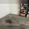 Before repairs, the garage floor showed noticeable uneven areas and low spots where the concrete had settled. These changes can happen when soil beneath the slab shifts or voids develop over time.