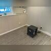The EverLast Half Wall and Elite Plank Flooring make it hard to imagine this basement was waterproofed.