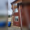 Radon system exits the home above concrete foundation wall.