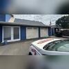 Meticulous surface protection and masking ensure flawless garage and door finishes.