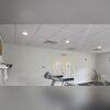 Before: Dull off-white walls make the treadmill area feel dim and dated.