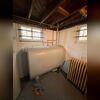 A photo reference of the basement before being waterproofed.